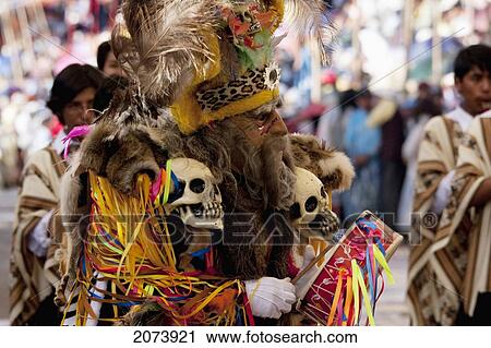 Stock Image - Tobas Dancer Wearing An Elaborate Mask, Feather Headdress And Costume In The Procession Of The Carnaval De Oruro, Oruro, Bolivia. Fotosearch