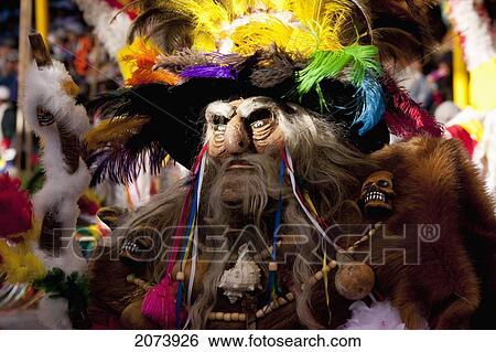 Tobas Dancer Wearing An Elaborate Mask, Feather Headdress And Costume In The Procession Of The Carnaval De Oruro, Oruro, Bolivia View Large Photo Image Stock Photograph - Tobas Dancer Wearing An Elaborate Mask, Feather Headdress And Costume In The Procession Of The Carnaval De Oruro, Oruro, Bolivia. Fotosearch