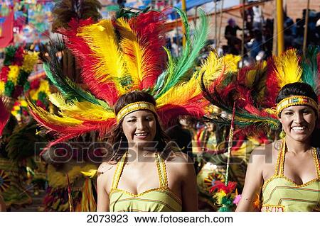 Tobas Dancers Wearing Elaborate Feather Headdresses And Costumes In The Procession Of The Carnaval De Oruro, Oruro, Bolivia View Large Photo Image Stock Image - Tobas Dancers Wearing Elaborate Feather Headdresses And Costumes In The Procession Of The Carnaval De Oruro, Oruro, Bolivia. Fotosearch