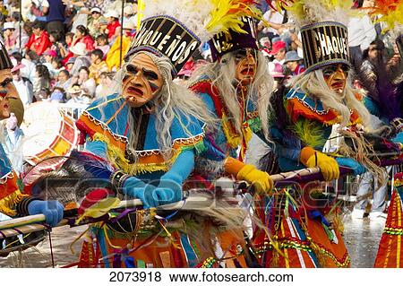 Tobas Dancers Wearing Elaborate Masks, Feather Headdresses And Costumes In The Procession Of The Carnaval De Oruro, Oruro, Bolivia View Large Photo Image Stock Photo - Tobas Dancers Wearing Elaborate Masks, Feather Headdresses And Costumes In The Procession Of The Carnaval De Oruro, Oruro, Bolivia. Fotosearch