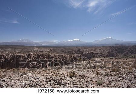 Toconce Gorge With Leon & Toconce Volcanoes In The Background, Antofagasta Region, Chile View Large Photo Image Stock Photo - Toconce Gorge With Leon & Toconce Volcanoes In The Background, Antofagasta Region, Chile. Fotosearch