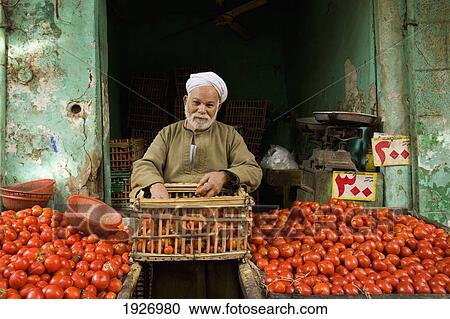 Stock Image - Tomato Seller At Stall. Fotosearch