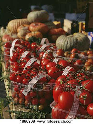 Stock Photo - Tomatoes And Pumpkins For Sale In Campo De Fiori. Fotosearch