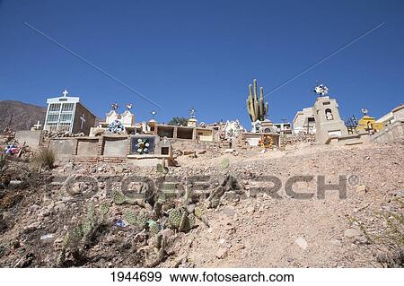 Stock Photo - Tombs at the hillside cemetery of Maimara, Jujuy, Argentina. Fotosearch