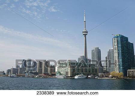 Toronto Skyline From Lake Ontario With Blue Sky And Clouds; Toronto, Ontario, Canada View Large Photo Image Stock Photo - Toronto Skyline From Lake Ontario With Blue Sky And Clouds; Toronto, Ontario, Canada. Fotosearch