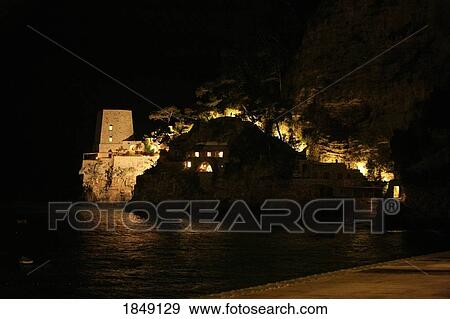 Stock Photo - Torre Clavel, Positano, Amalfi Coast, Italy; Waterfront Buildings Illuminated At Night. Fotosearch