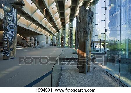 Stock Image - Totem Poles In The Great Hall Of The Anthropology Museum Of The University Of British Columbia, Vancouver, British Columbia, Canada. Fotosearch