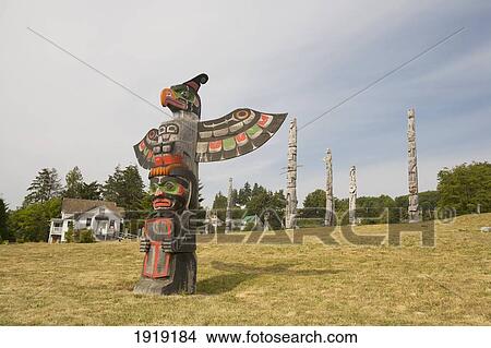 Totem Poles In The Namgis Burial Grounds; Alert Bay, Cormorant Island, British Columbia, Canada View Large Photo Image Picture - Totem Poles In The Namgis Burial Grounds; Alert Bay, Cormorant Island, British Columbia, Canada. Fotosearch