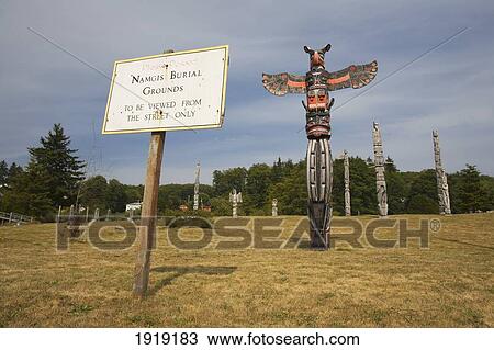 Totem Poles In The Namgis Burial Grounds; Alert Bay, Cormorant Island, British Columbia, Canada View Large Photo Image Stock Image - Totem Poles In The Namgis Burial Grounds; Alert Bay, Cormorant Island, British Columbia, Canada. Fotosearch