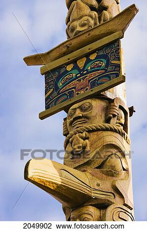 Stock Image - Totem Poles, New Aiyansh, British Columbia. Fotosearch