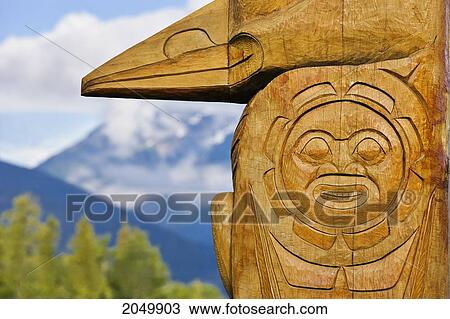 Stock Image - Totem Poles, New Aiyansh, British Columbia. Fotosearch