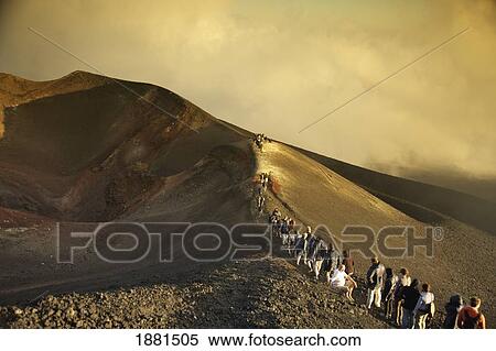 Stock Photography - Tour Group Climbing Mount Etna; Taormina, Sicily, Italy. Fotosearch