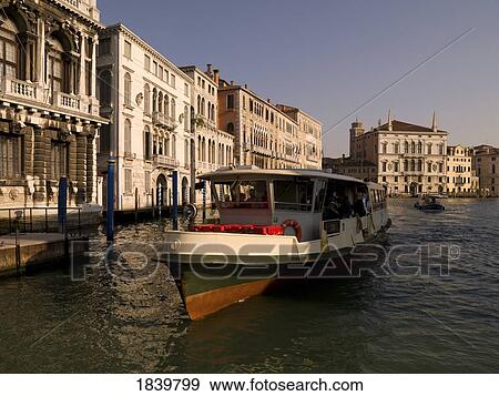 Stock Photo - Tourboat Transporting Tourists On Canal; Grand Canal, Venice, Italy. Fotosearch