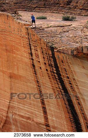 Stock Photo - Tourist at Kings Canyon; Northern Territory, Australia. Fotosearch