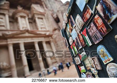Stock Photo - Tourist badges for sale outside the Treasury at Petra, also known as El Khazneh Nabataean, one of the new Seven Wonders of the World; Petra, Jordan. Fotosearch