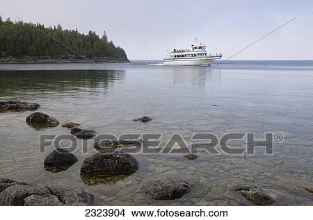 Tourist boat in Georgian Bay by Bruce Peninsula National Park; Ontario, Canada View Large Photo Image Picture - Tourist boat in Georgian Bay by Bruce Peninsula National Park; Ontario, Canada. Fotosearch