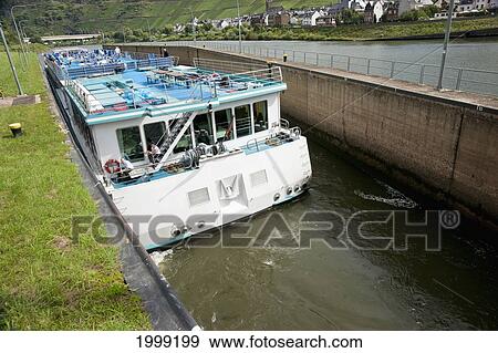 Stock Photo - Tourist Boat Passing Through Lock; Sankt Aldegund Rhineland-Palatinate Germany. Fotosearch