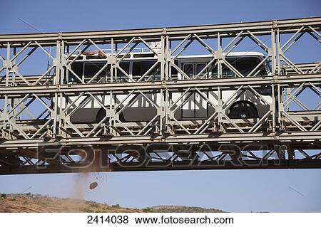 Tourist bus crossing broken bridge; Gheralta, Tigray region, Ethiopia View Large Photo Image Stock Photo - Tourist bus crossing broken bridge; Gheralta, Tigray region, Ethiopia. Fotosearch