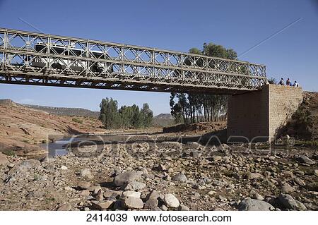 Tourist bus crossing broken bridge; Gheralta, Tigray region, Ethiopia View Large Photo Image Stock Photo - Tourist bus crossing broken bridge; Gheralta, Tigray region, Ethiopia. Fotosearch