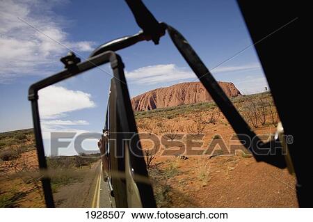 Stock Photo - Tourist Bus On Road To Uluru, Kata Tjuta National Park, Northern Territory, Australia. Fotosearch