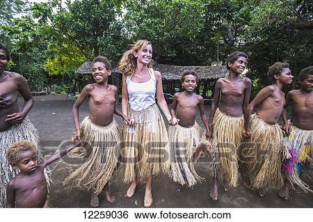 Tourist dances with young girls at Yakel Village; Tanna Island, Vanuatu View Large Photo Image Stock Photograph - Tourist dances with young girls at Yakel Village; Tanna Island, Vanuatu. Fotosearch