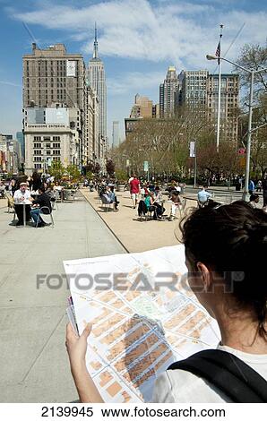 Stock Photography - Tourist Girl Checking A Map In Madison Square Park, Manhattan, New York, Usa. Fotosearch