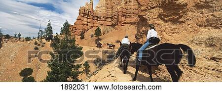 Stock Image - Tourist Group Riding Horses In Bryce Canyon. Fotosearch