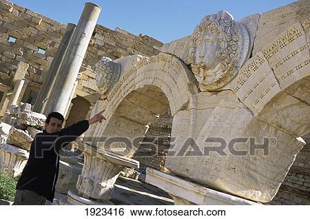 Stock Photograph - Tourist guide in Imperial Forum.. Fotosearch