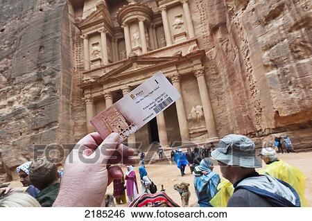 Tourist Holds Up His Expensive Entrance Ticket To Petra Outside The Temple Or Treasury In Petra, Jordan, Middle East View Large Photo Image Stock Photograph - Tourist Holds Up His Expensive Entrance Ticket To Petra Outside The Temple Or Treasury In Petra, Jordan, Middle East. Fotosearch