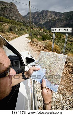Tourist In Sunglasses In Car Checking Map View Large Photo Image Stock Image - Tourist In Sunglasses In Car Checking Map. Fotosearch