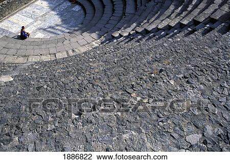 Stock Image - Tourist In The Odeion In Pompeii. Fotosearch