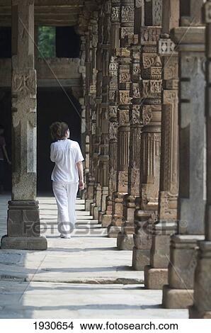 Tourist in the Qutab complex which includes the world's tallest brick minaret - the Minar - as well as a series of Indo-Islamic buildings. Construction of the complex was started in 1193 under the orders of India's first Muslim ruler Qutb-ud-din Aibak. View Large Photo Image Picture - Tourist in the Qutab complex which includes the world's tallest brick minaret - the Minar - as well as a series of Indo-Islamic buildings. Construction of the complex was started in 1193 under the orders of India's first Muslim ruler Qutb-ud-din Aibak.. Fotosearch