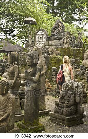 Tourist Observing Statues For Sale View Large Photo Image Stock Image - Tourist Observing Statues For Sale. Fotosearch