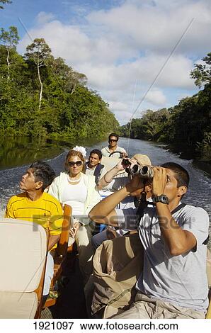 Stock Photo - Tourist on Boat on Amazon Tributary; Peru. Fotosearch