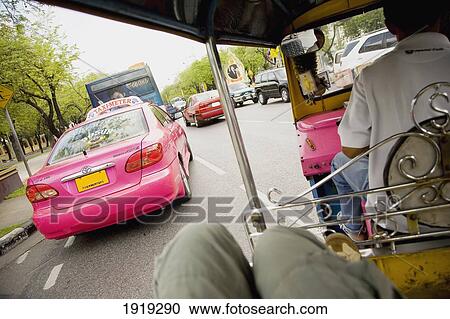 Stock Image - Tourist On Tuk Tuk In Bangkok; Bangkok, Thailand. Fotosearch