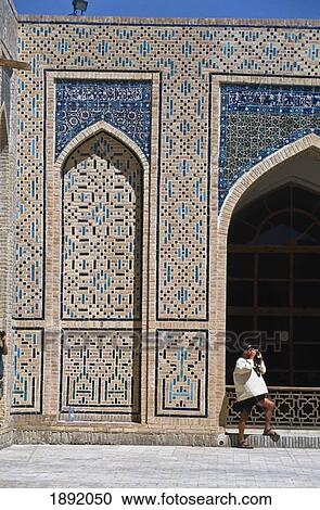 Stock Image - Tourist Outside Kalon Mosque. Fotosearch