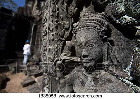 Stock Photo - Tourist Outside Temple In Ancient City Of Angkor; Angkor Wat, Siem Reap, Cambodia. Fotosearch