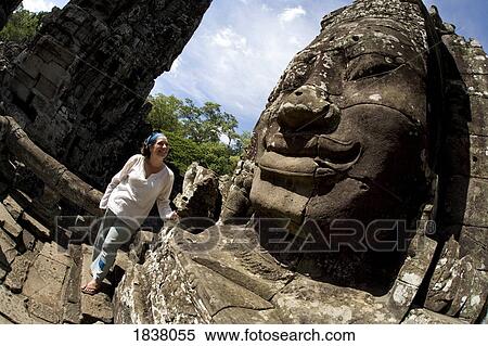 Stock Photography - Tourist Outside Temple In Ancient City Of Angkor; Angkor Wat, Siem Reap, Cambodia. Fotosearch