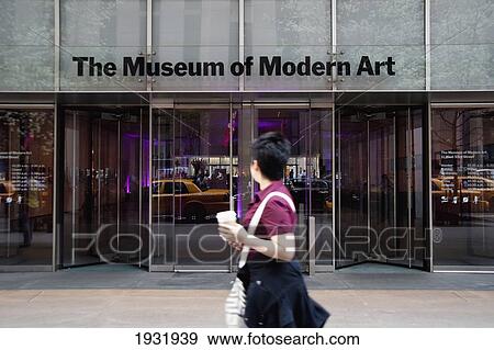 Stock Photo - Tourist Passing In Front Of The Museum Of Modern Art Also Known As Moma, Manhattan, New York, Usa. Fotosearch
