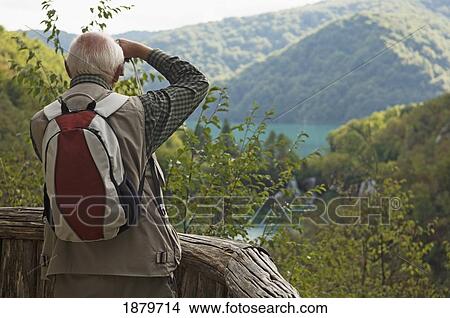 Tourist Photographing At Plitvice Lakes National Park. View Large Photo Image Picture - Tourist Photographing At Plitvice Lakes National Park.. Fotosearch