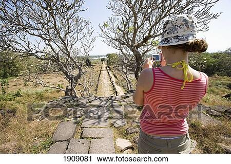 Tourist Photographing Ruins At Wat Phu Champasak, Savannakhet, Southern Laos View Large Photo Image Stock Image - Tourist Photographing Ruins At Wat Phu Champasak, Savannakhet, Southern Laos. Fotosearch