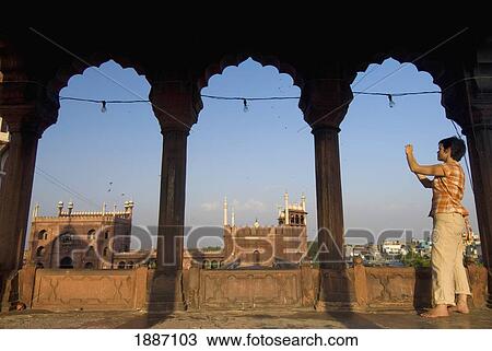 Stock Image - Tourist Photographing The Jami Masjid. Fotosearch