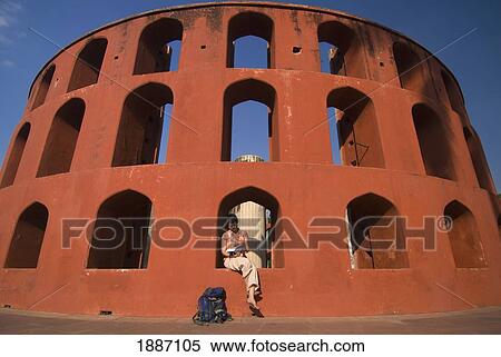 Stock Photography - Tourist Reading Guide Book In The Jantar Mantar Observatory. Fotosearch