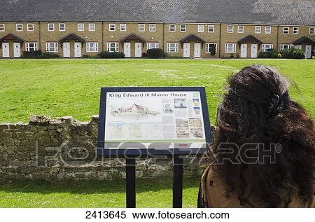 Tourist reading sign about King Edward III Manor House ruins, Bermondsey; London, England View Large Photo Image Stock Photography - Tourist reading sign about King Edward III Manor House ruins, Bermondsey; London, England. Fotosearch