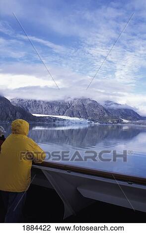 Tourist Standing At Railing Of Cruise Boat Looking At Glacier View Large Photo Image Stock Image - Tourist Standing At Railing Of Cruise Boat Looking At Glacier. Fotosearch