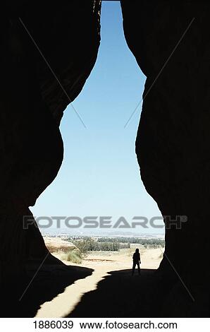 Stock Photo - Tourist Standing In Between Eroded Rocks At The Diwan. Fotosearch