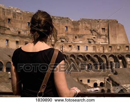 Tourist Standing In The Flavian Amphitheater (Colosseum); Rome, Italy View Large Photo Image Stock Image - Tourist Standing In The Flavian Amphitheater (Colosseum); Rome, Italy. Fotosearch