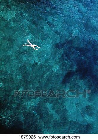 Stock Photograph - Tourist Swimming In The Sea. Fotosearch