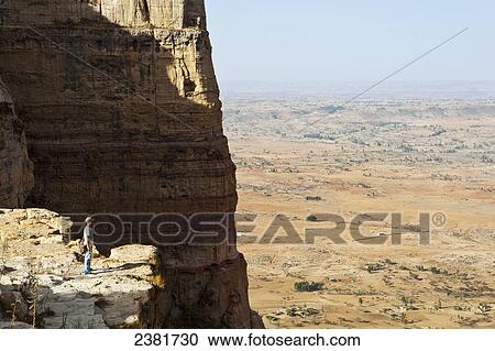 Tourist trekking in the amazing mountain scenery on the Gheralta plateau; Tigray region, Ethiopia View Large Photo Image Stock Image - Tourist trekking in the amazing mountain scenery on the Gheralta plateau; Tigray region, Ethiopia. Fotosearch