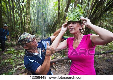 Tourist trying on a leaf hat during jungle trek at Ulu Temburong National Park; Brunei View Large Photo Image Stock Photo - Tourist trying on a leaf hat during jungle trek at Ulu Temburong National Park; Brunei. Fotosearch